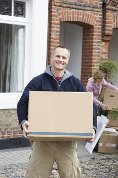 Professional movers packing items in London