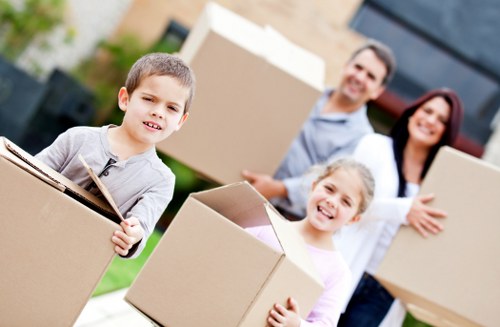Man with van helping load furniture into a vehicle